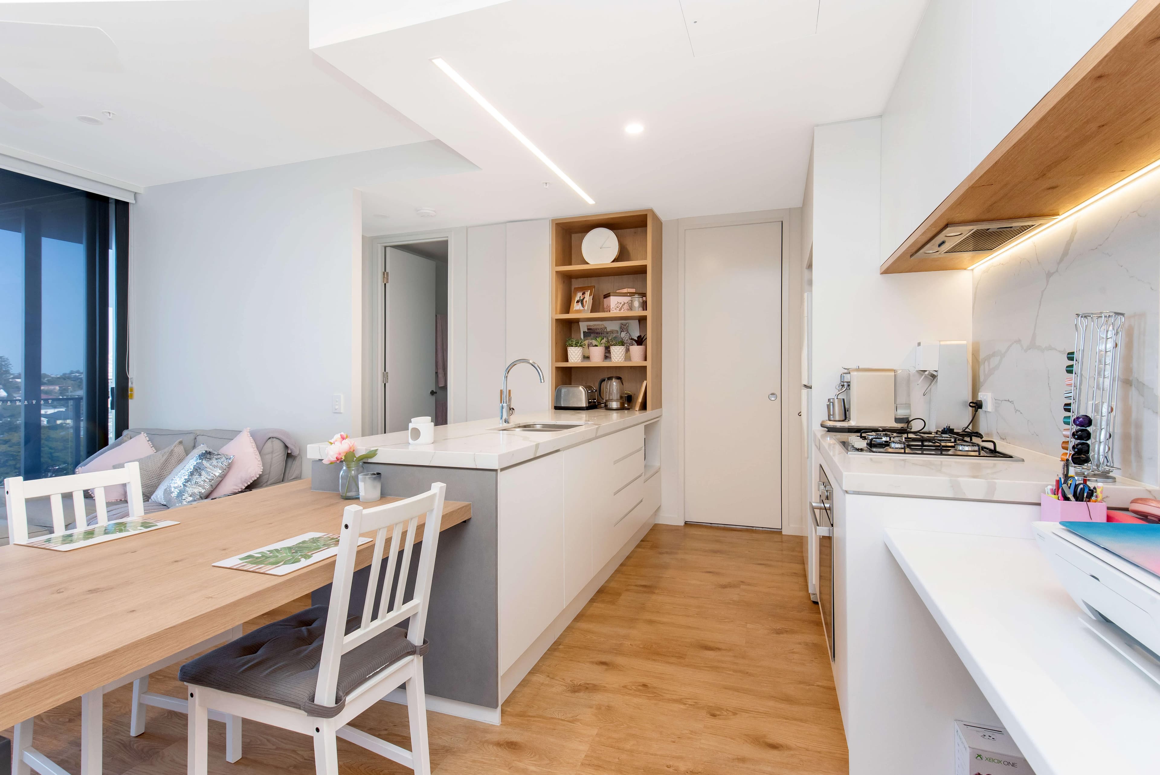Kitchen and living space in a LINK Living managed New Farm apartment